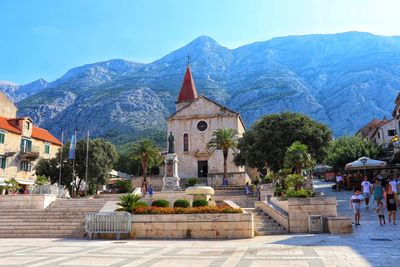 View of buildings against mountain range