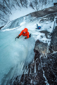 High angle view of people on snowcapped mountain