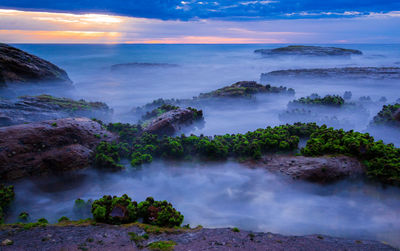 Scenic view of sea against sky during sunset