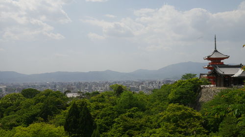 Scenic view of mountains against cloudy sky