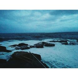 Scenic view of sea against cloudy sky