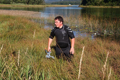 Full length of man standing in a lake