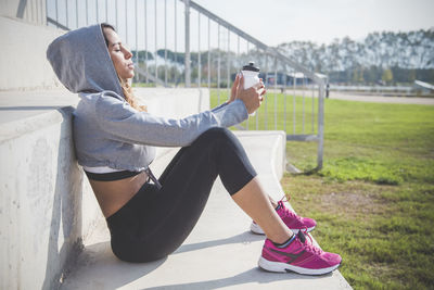 Portrait of woman relaxing on steps