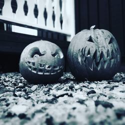 Close-up of pumpkin on stone wall during halloween