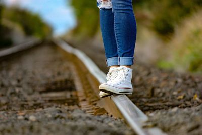 Low section of person walking on footpath