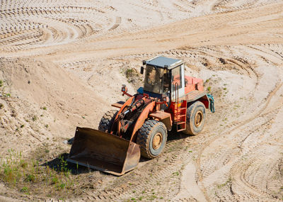 Gravel quarrying in a gravel pit during a drone flight