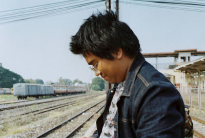 Man looking at railroad station