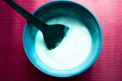 High angle view of hair dye in container