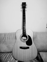 Close-up of guitar at home