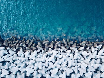 High angle view of stones in sea