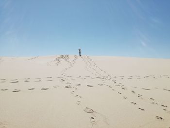 Scenic view of desert against clear sky