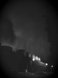 Low angle view of building against clear sky at night