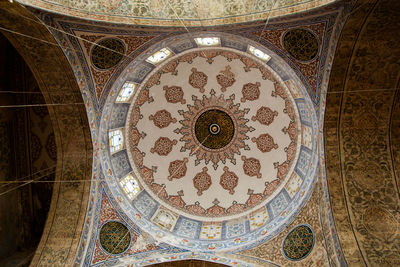 Directly below shot of ceiling of building