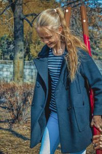 Smiling girl standing in park