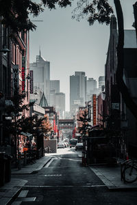 City street and buildings against sky