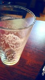 Close-up of beer glass on table