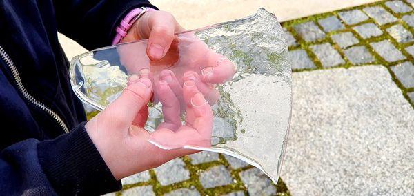 High angle view of person holding hands