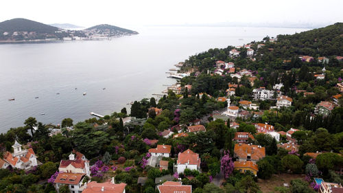 High angle view of townscape by sea