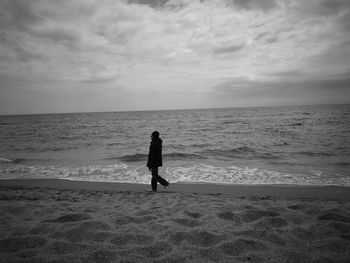 Man walking on beach