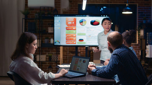 Young woman using laptop at table