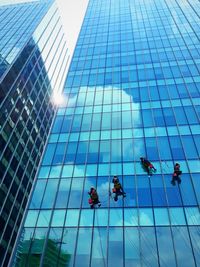 Low angle view of workers on modern office building