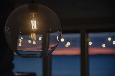 Close-up of illuminated light bulb