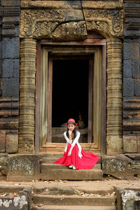 Portrait of woman with red umbrella