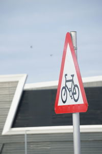 Close-up of warning sign on road