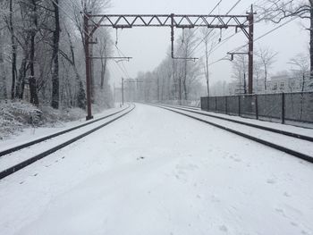 View of snow covered railroad track