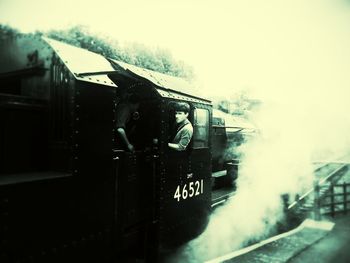 Railroad station platform seen through train window