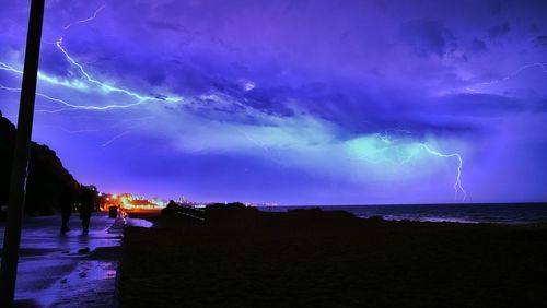 Scenic view of sea against sky at night