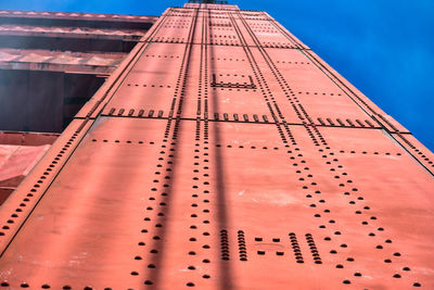 Low angle view of building against blue sky