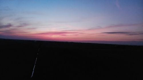 Scenic view of silhouette landscape against sky during sunset