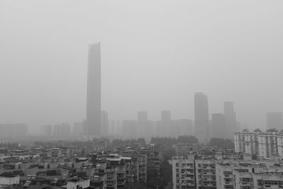 Buildings in city against sky