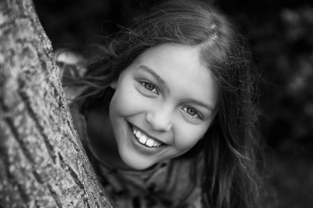 portrait, looking at camera, person, headshot, childhood, smiling, focus on foreground, front view, lifestyles, elementary age, young women, girls, close-up, leisure activity, young adult, cute, happiness, innocence