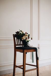 Potted plant on table against wall at home