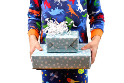 Low section of person standing in box against white background