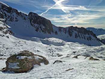 Scenic view of snowcapped mountains against sky