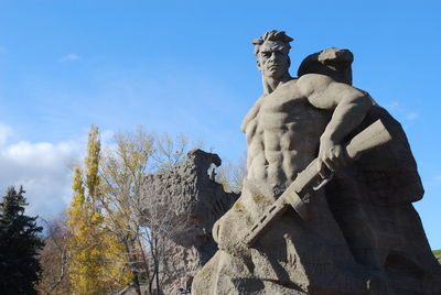 Low angle view of sculptures at mamayev kurgan park against sky