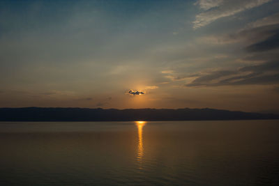 Scenic view of lake against sky during sunset