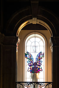 Low angle view of ornate window in building