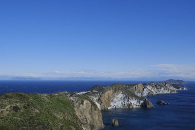 Panoramic view of sea against blue sky