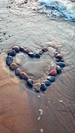 High angle view of pebbles on beach