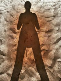 Shadow of man on sand