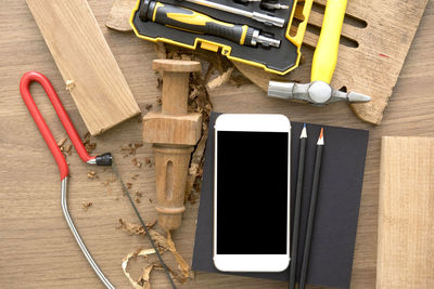 High angle view of telephone booth on table