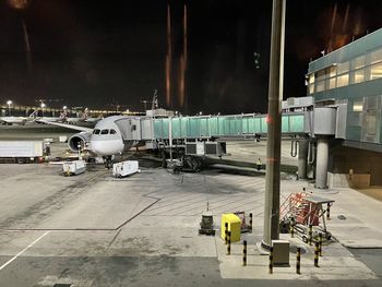 Airplane on airport runway at night