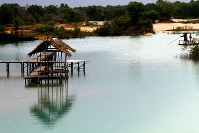 Pier in lake against sky