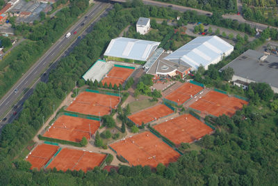 High angle view of houses on field against sky