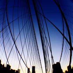Low angle view of modern building against blue sky