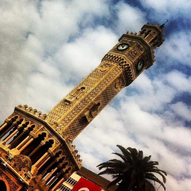 architecture, low angle view, built structure, sky, building exterior, cloud - sky, tower, famous place, cloudy, tall - high, travel destinations, international landmark, tourism, travel, history, capital cities, cloud, city, architectural feature, tree